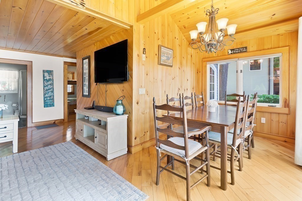 40 Over The Top Road Holland, MA 01521 - Photo 7 of 41 a living room with a flat screen tv and a dining table