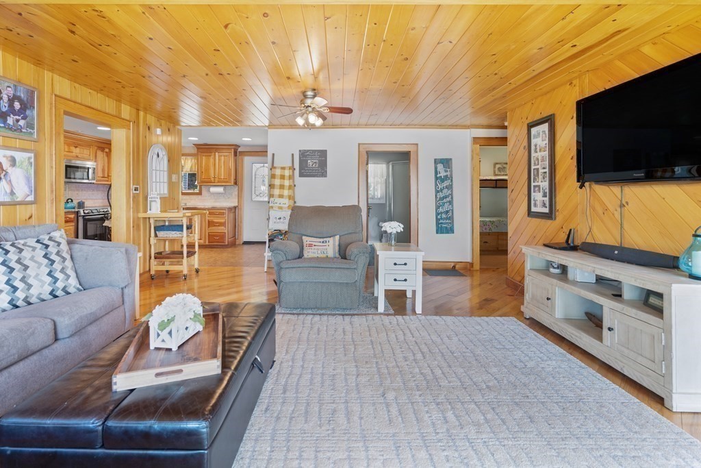 40 Over The Top Road Holland, MA 01521 - Photo 8 of 41 a living room with furniture and a flat screen tv