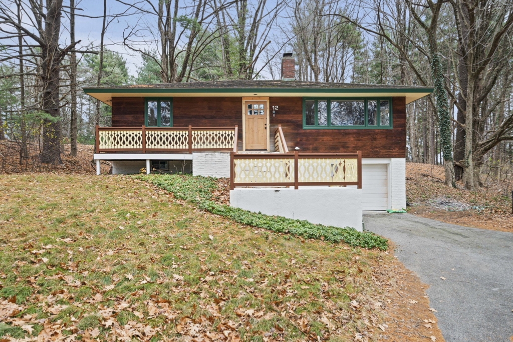 12 Sabrina Farm Wellesley, MA 02482 - Photo 1 of 16 a front view of a house with a street