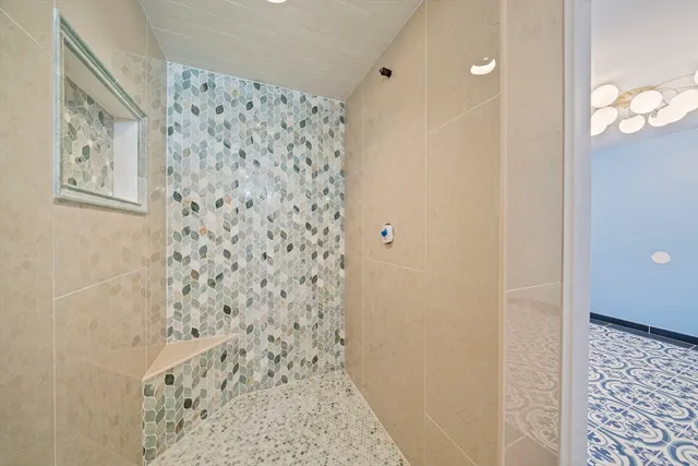a bathroom with a shower and a shower curtain