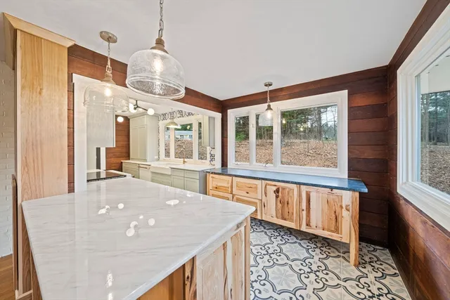 a view of a living room and kitchen