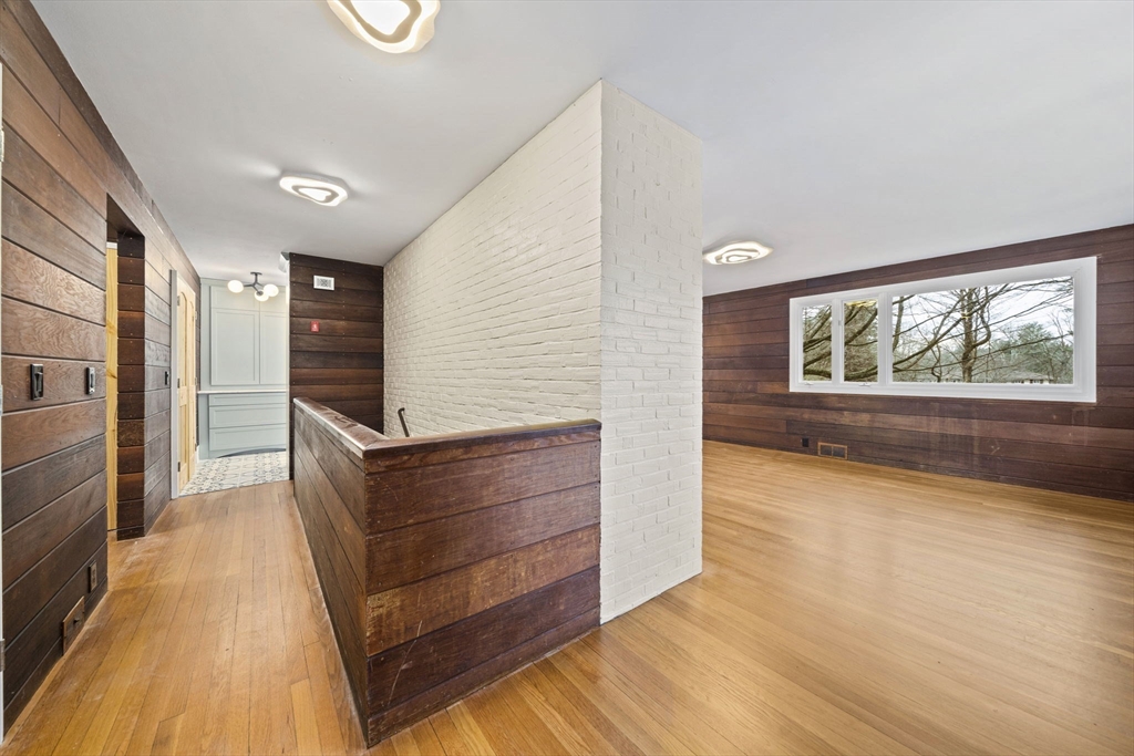 12 Sabrina Farm Wellesley, MA 02482 - Photo 8 of 16 a view of room with window and wooden floor