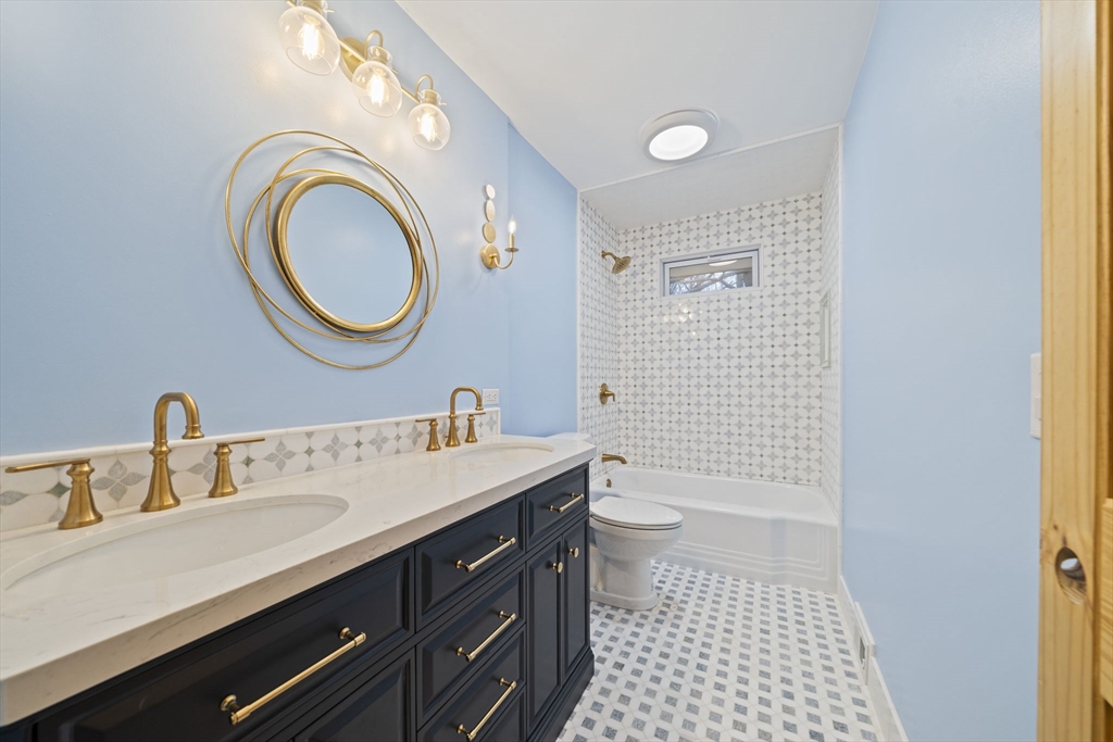 12 Sabrina Farm Wellesley, MA 02482 - Photo 10 of 16 a bathroom with a sink a toilet and a mirror