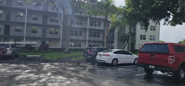 a car parked in front of a brick house