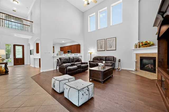 a living room with furniture and a fireplace