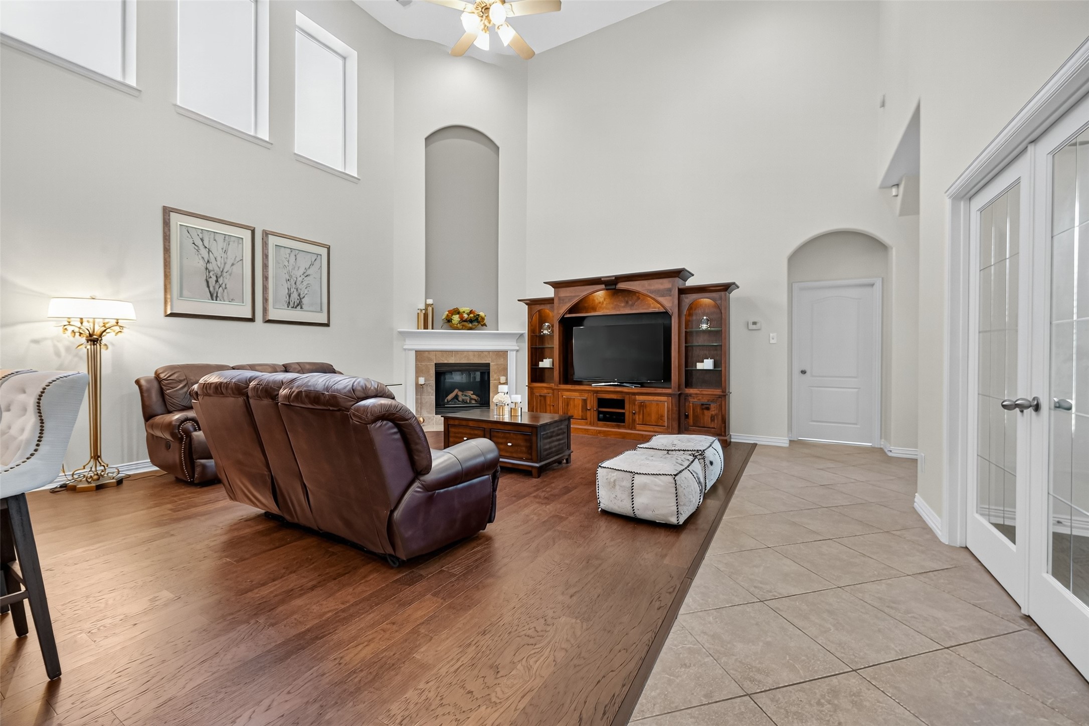 24914 Hazel Ranch Drive Katy, TX 77494 - Photo 11 of 45 a living room with furniture a flat screen tv and a fireplace