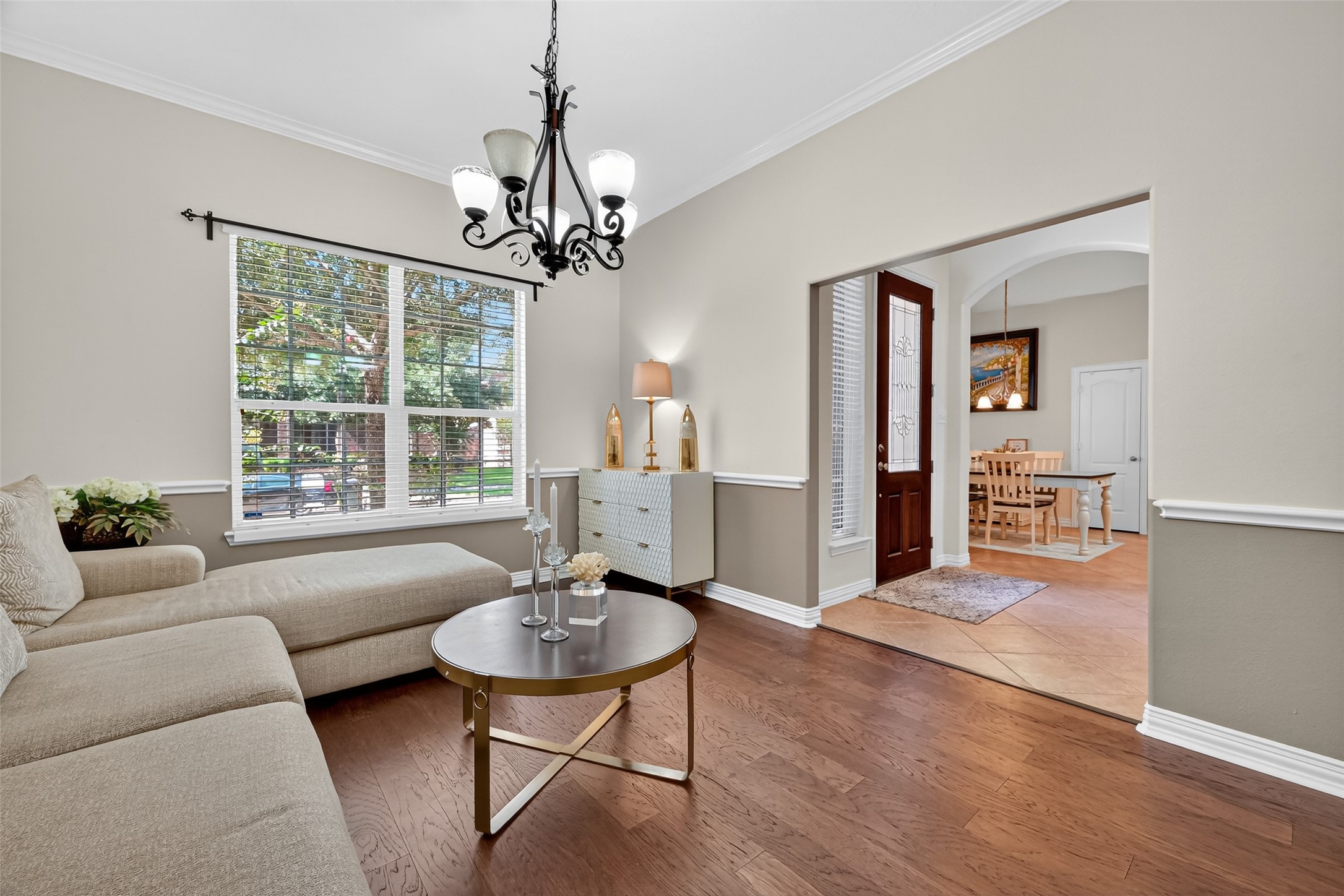 24914 Hazel Ranch Drive Katy, TX 77494 - Photo 12 of 45 a living room with furniture and a chandelier
