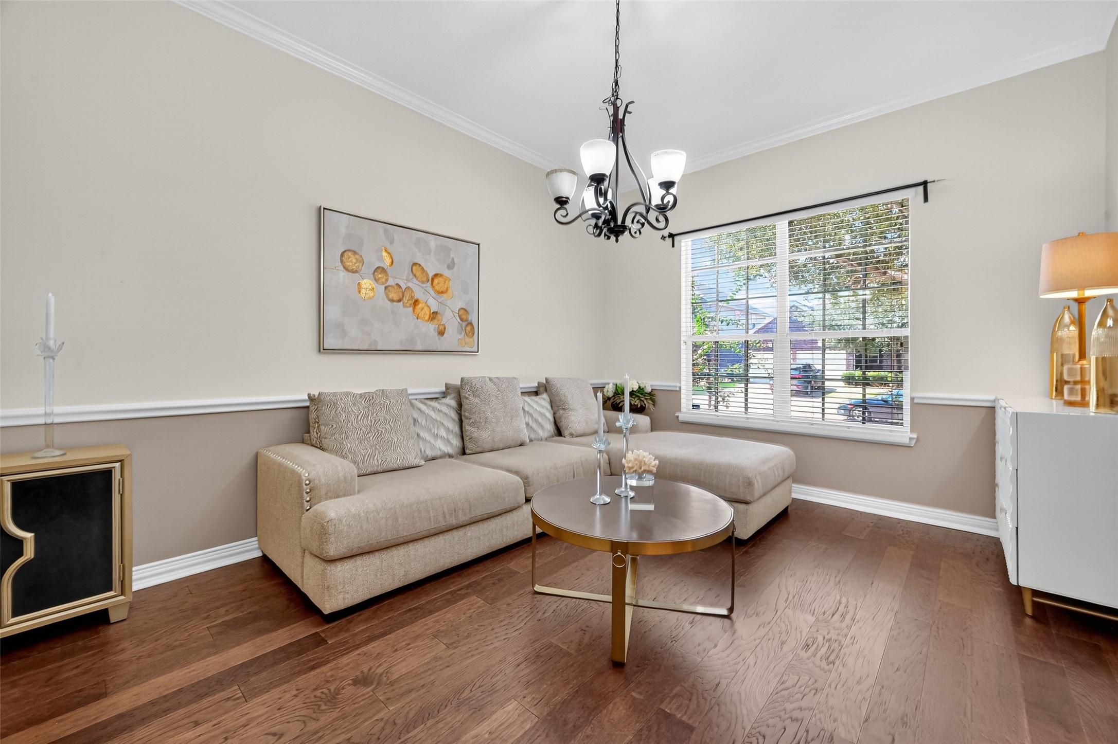 24914 Hazel Ranch Drive Katy, TX 77494 - Photo 16 of 45 a living room with furniture and a chandelier