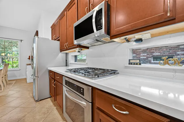 a kitchen with a stove and a microwave