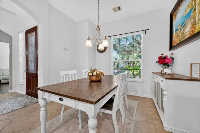 a view of a dining table and chairs in a room