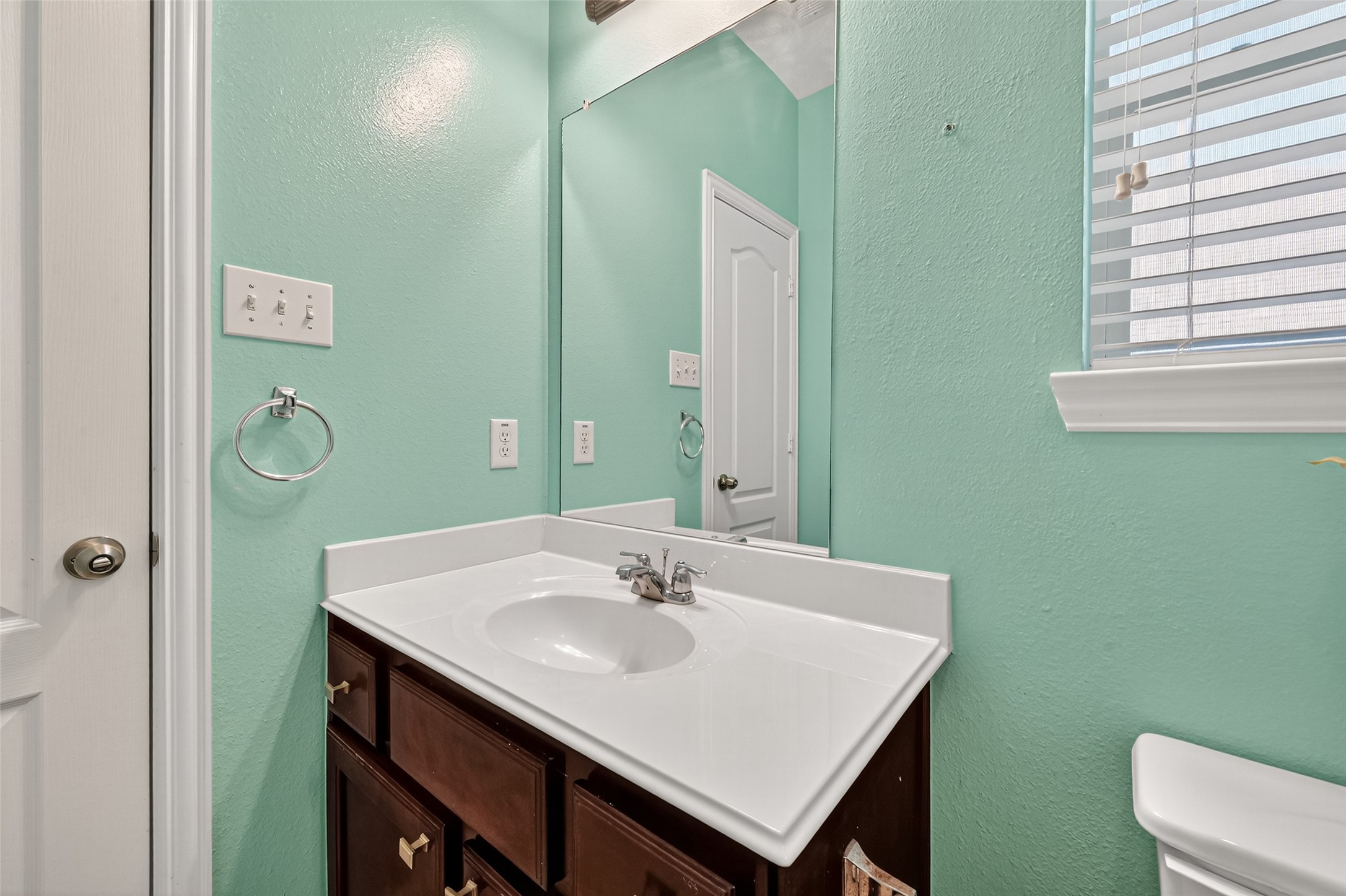 24914 Hazel Ranch Drive Katy, TX 77494 - Photo 27 of 45 a bathroom with a sink and a mirror