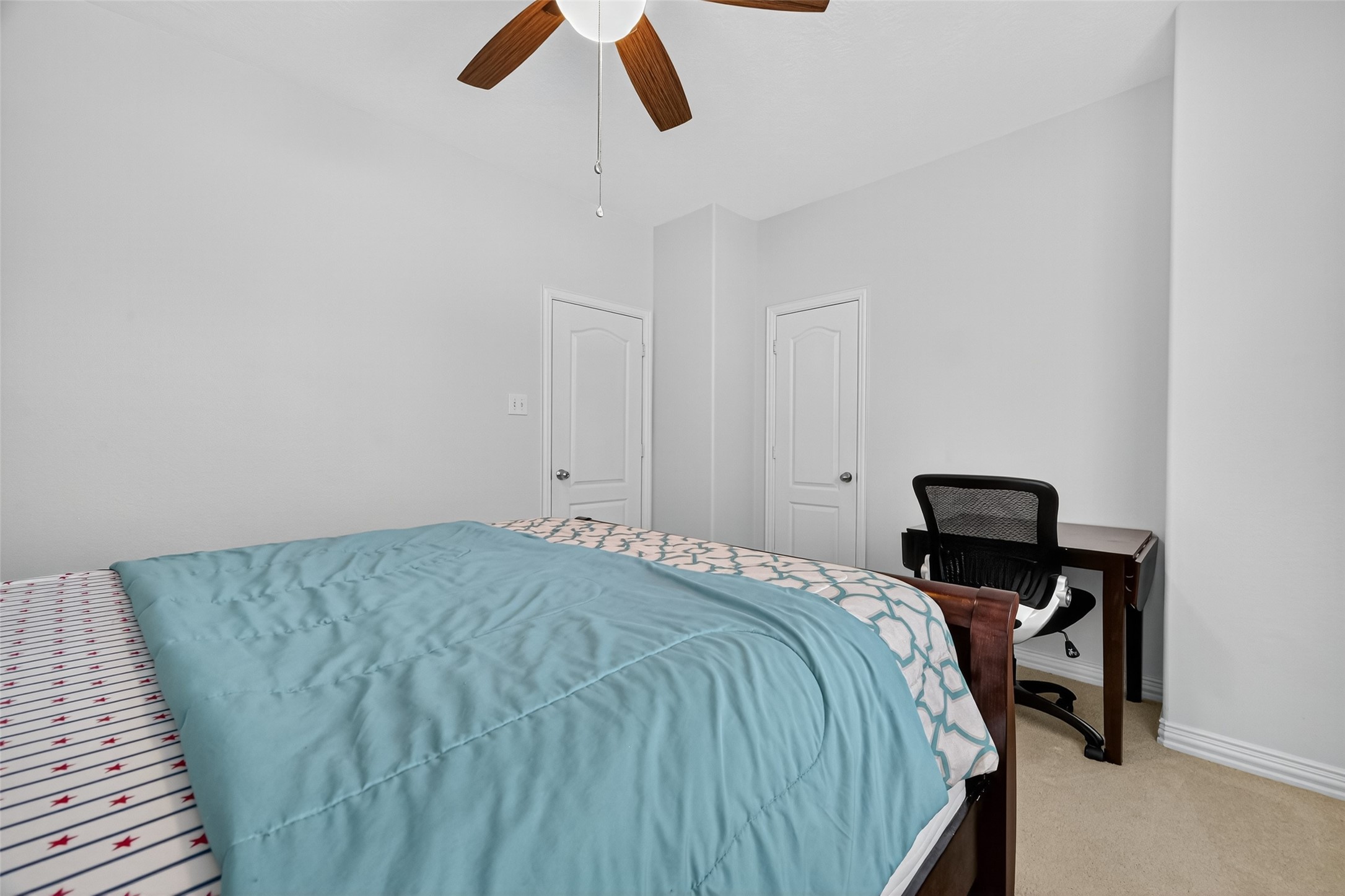 24914 Hazel Ranch Drive Katy, TX 77494 - Photo 29 of 45 a bedroom with a bed and cabinets