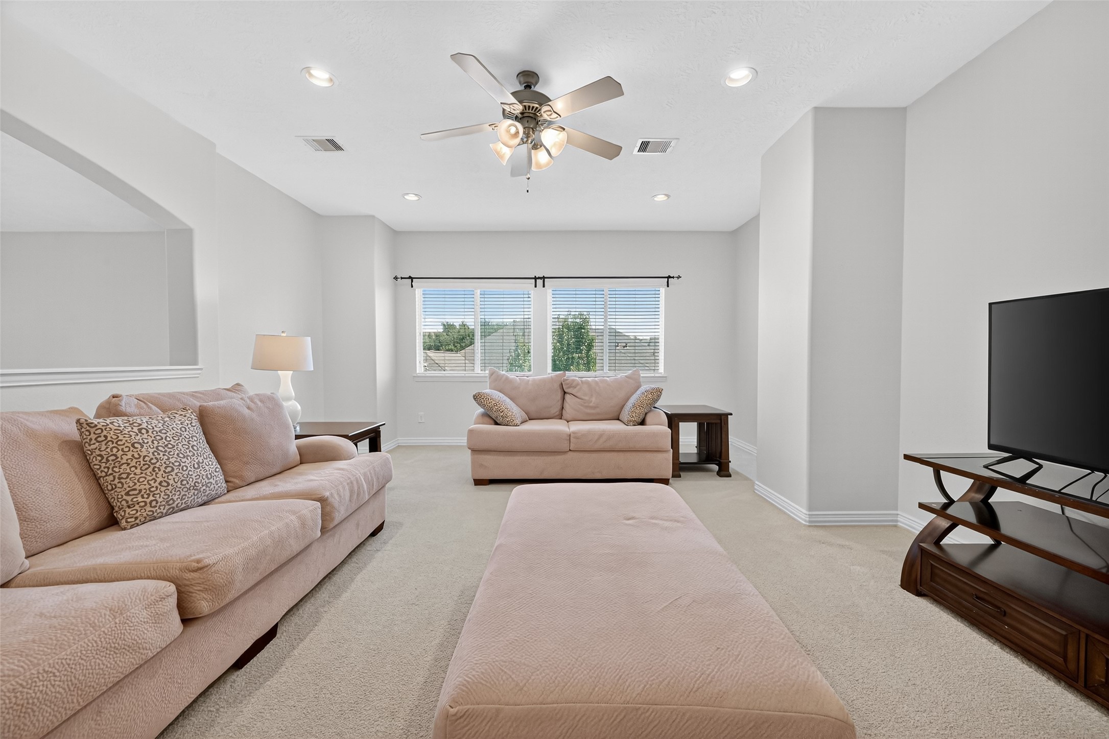 24914 Hazel Ranch Drive Katy, TX 77494 - Photo 3 of 45 a living room with furniture and a flat screen tv