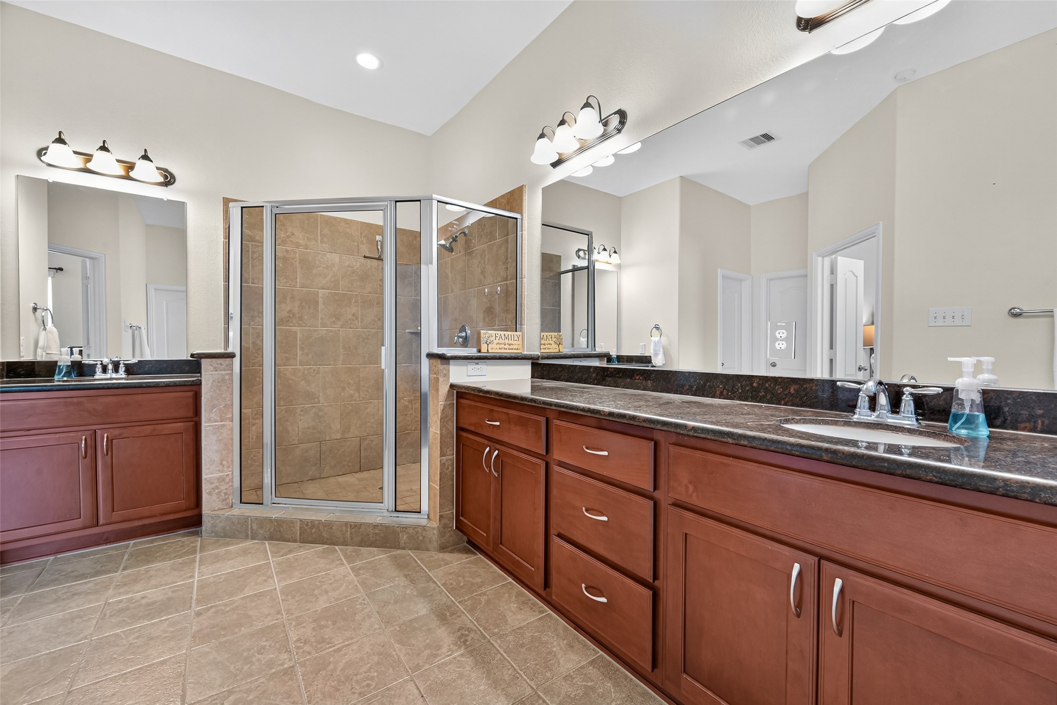 24914 Hazel Ranch Drive Katy, TX 77494 - Photo 35 of 45 a spacious bathroom with a granite countertop double vanity sink mirror and shower