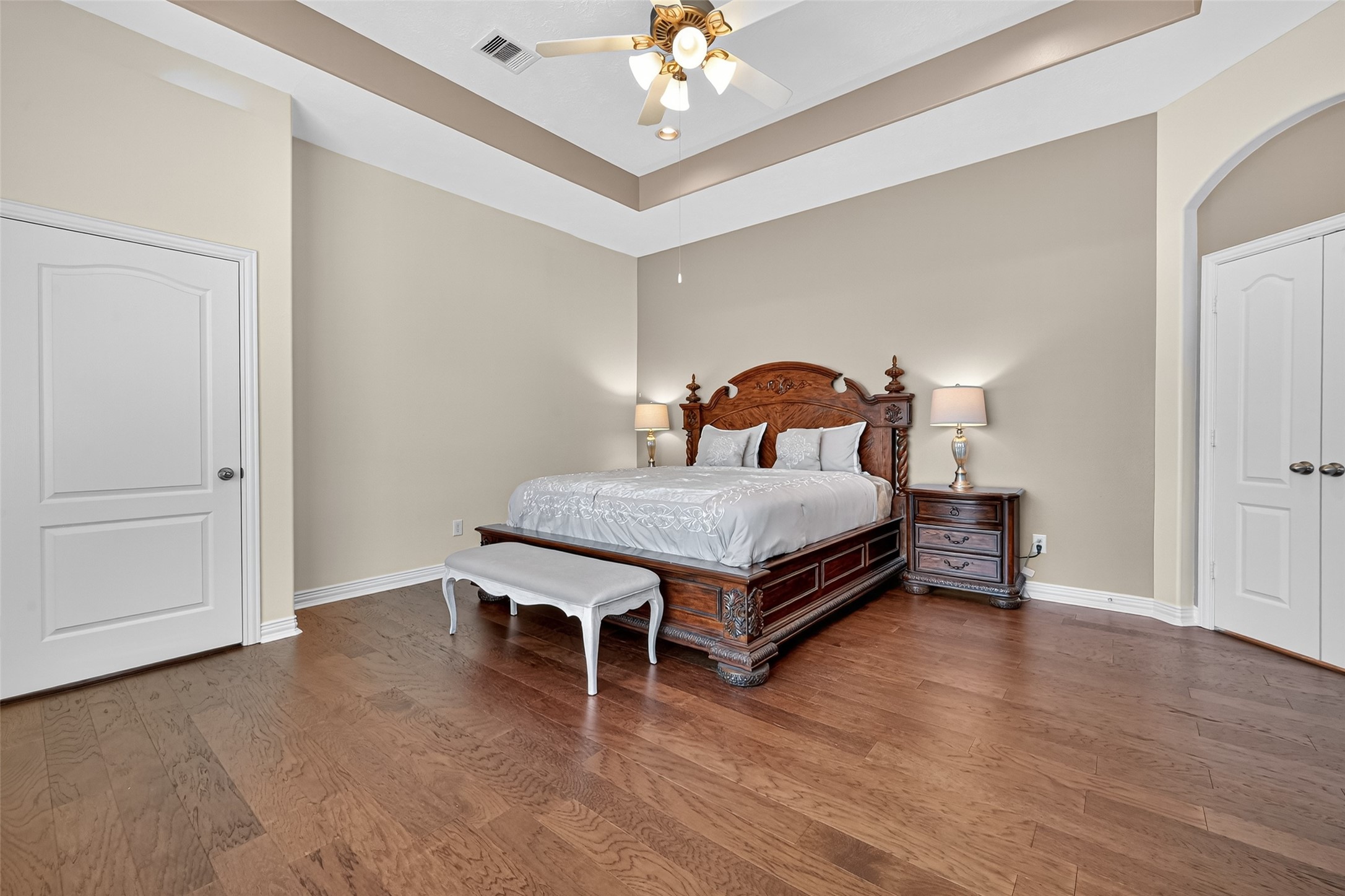 24914 Hazel Ranch Drive Katy, TX 77494 - Photo 39 of 45 a bedroom with a bed and a chandelier