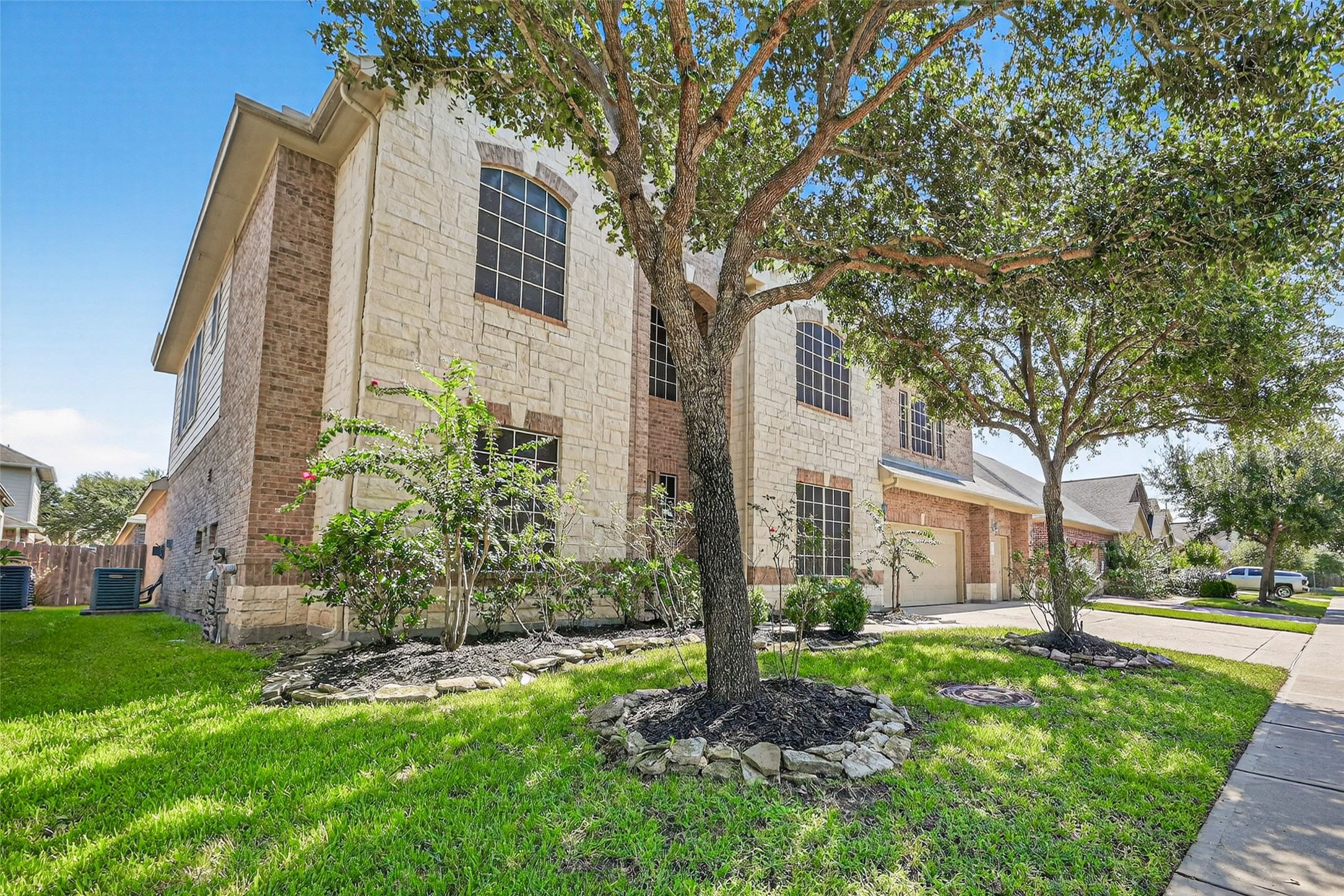24914 Hazel Ranch Drive Katy, TX 77494 - Photo 4 of 45 a view of a tall brick building next to a yard