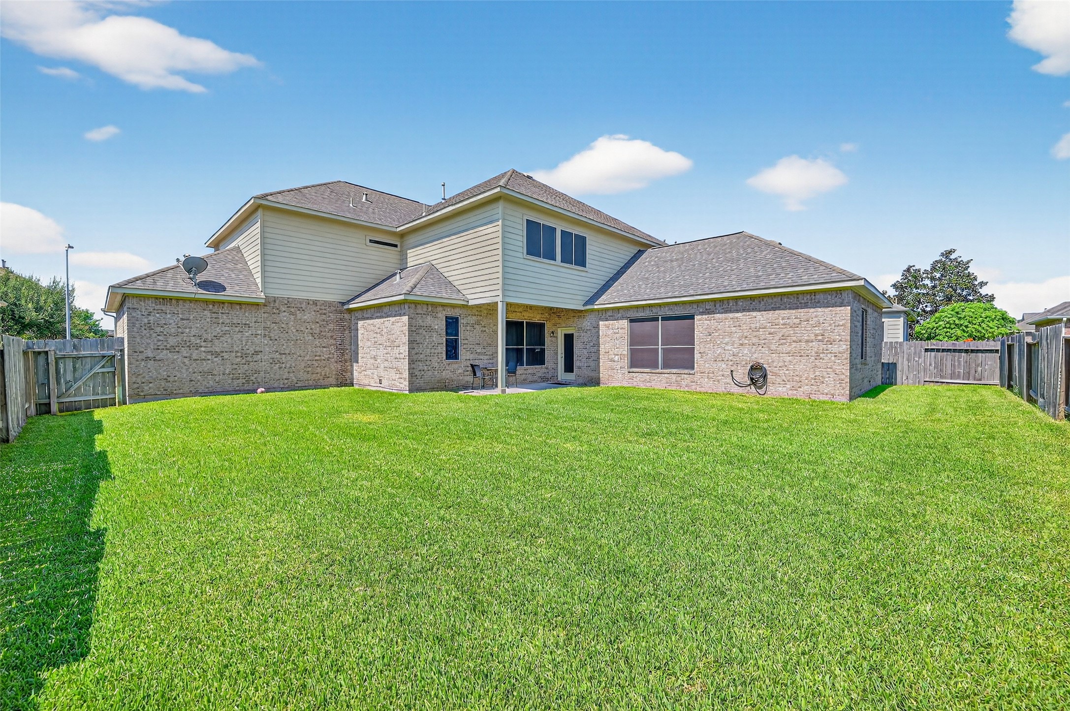 24914 Hazel Ranch Drive Katy, TX 77494 - Photo 43 of 45 a view of a house with a big yard potted plants and large tree
