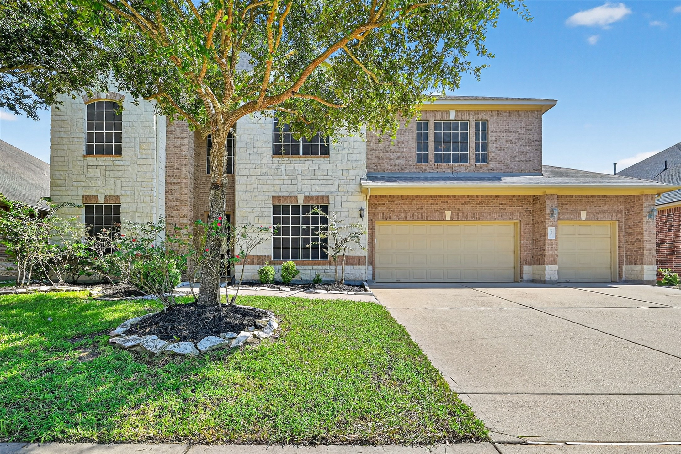 24914 Hazel Ranch Drive Katy, TX 77494 - Photo 7 of 45 a front view of a house with a yard and garage