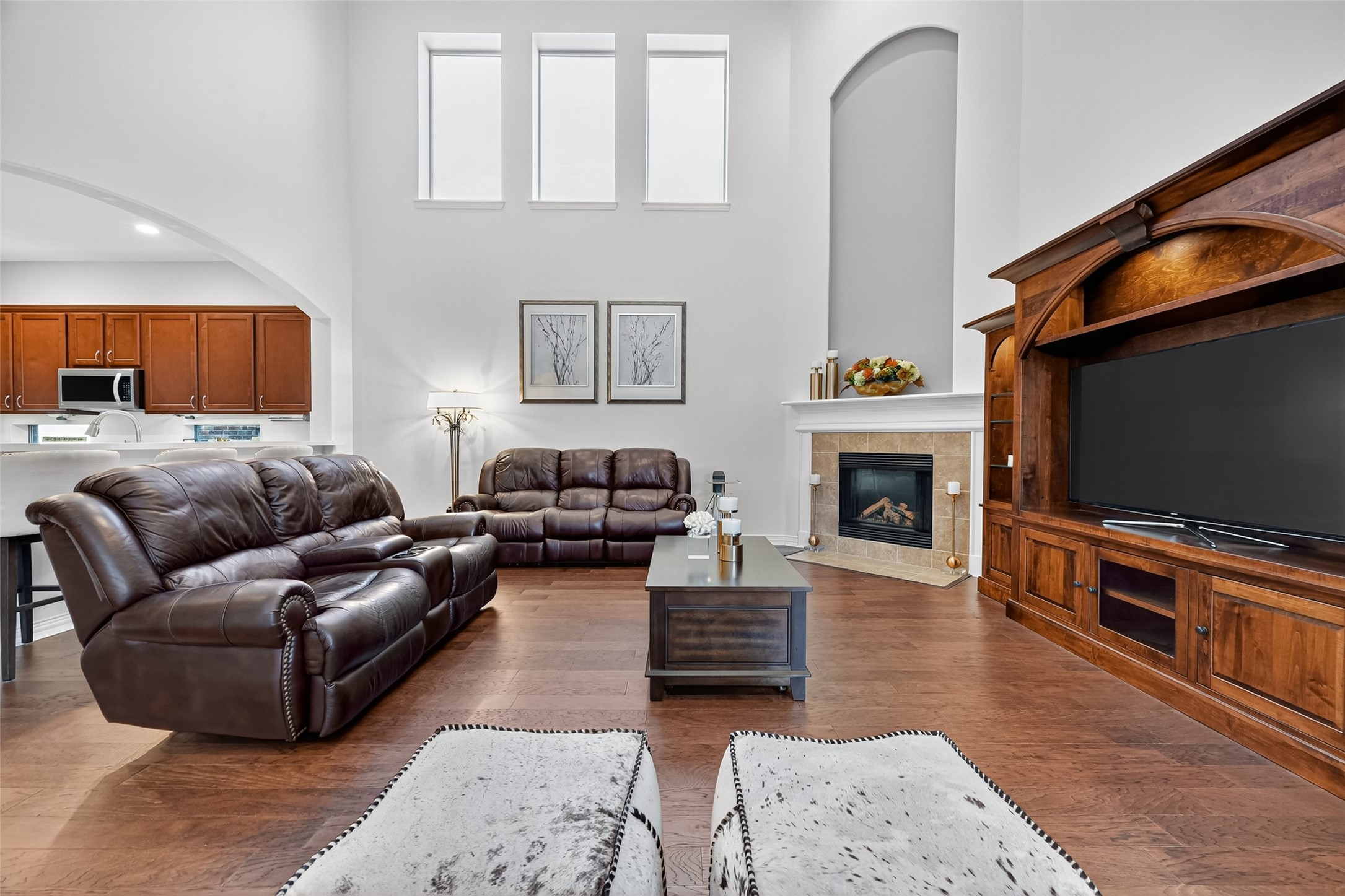 24914 Hazel Ranch Drive Katy, TX 77494 - Photo 10 of 45 a living room with furniture a flat screen tv and a fireplace
