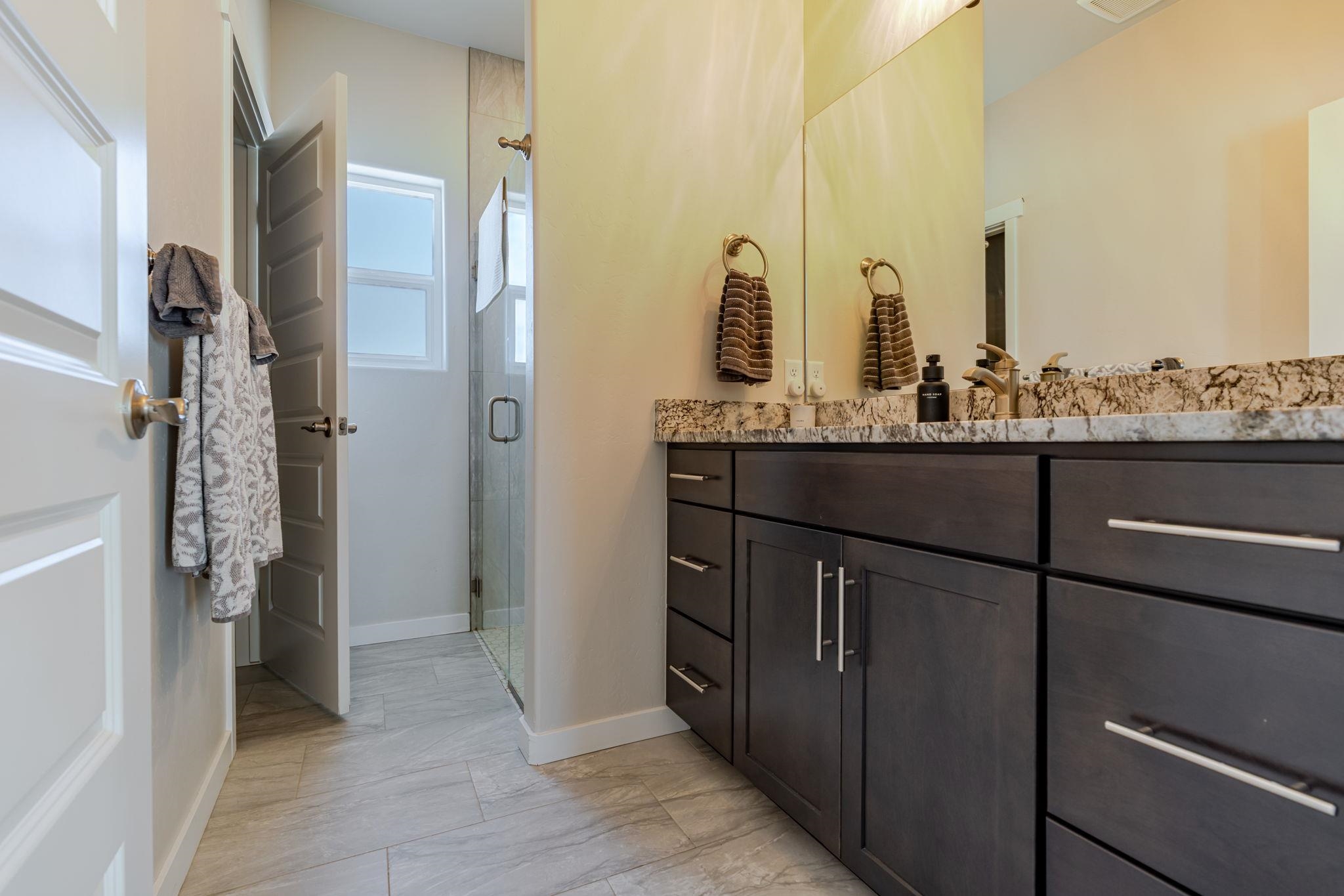 1301 M Road Loma, CO 81524 - Photo 10 of 32 a bathroom with a double vanity sink and mirror