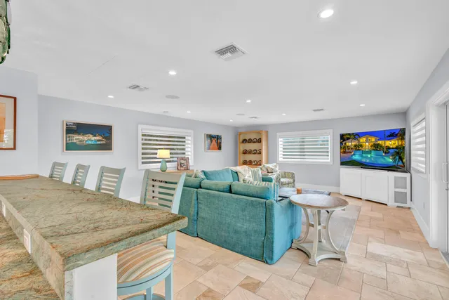 a bed room with a bed and a chair