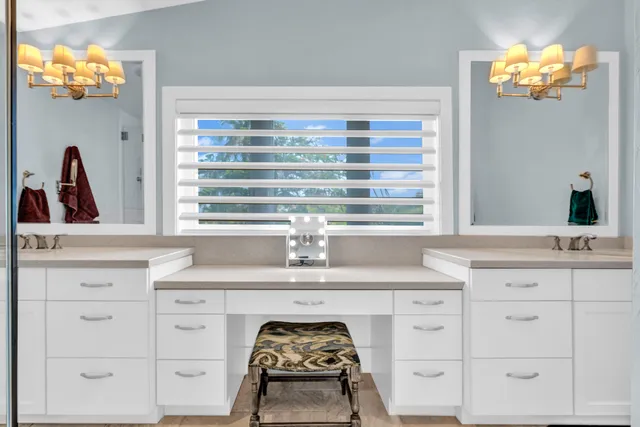 a view of backyard with swimming pool and seating