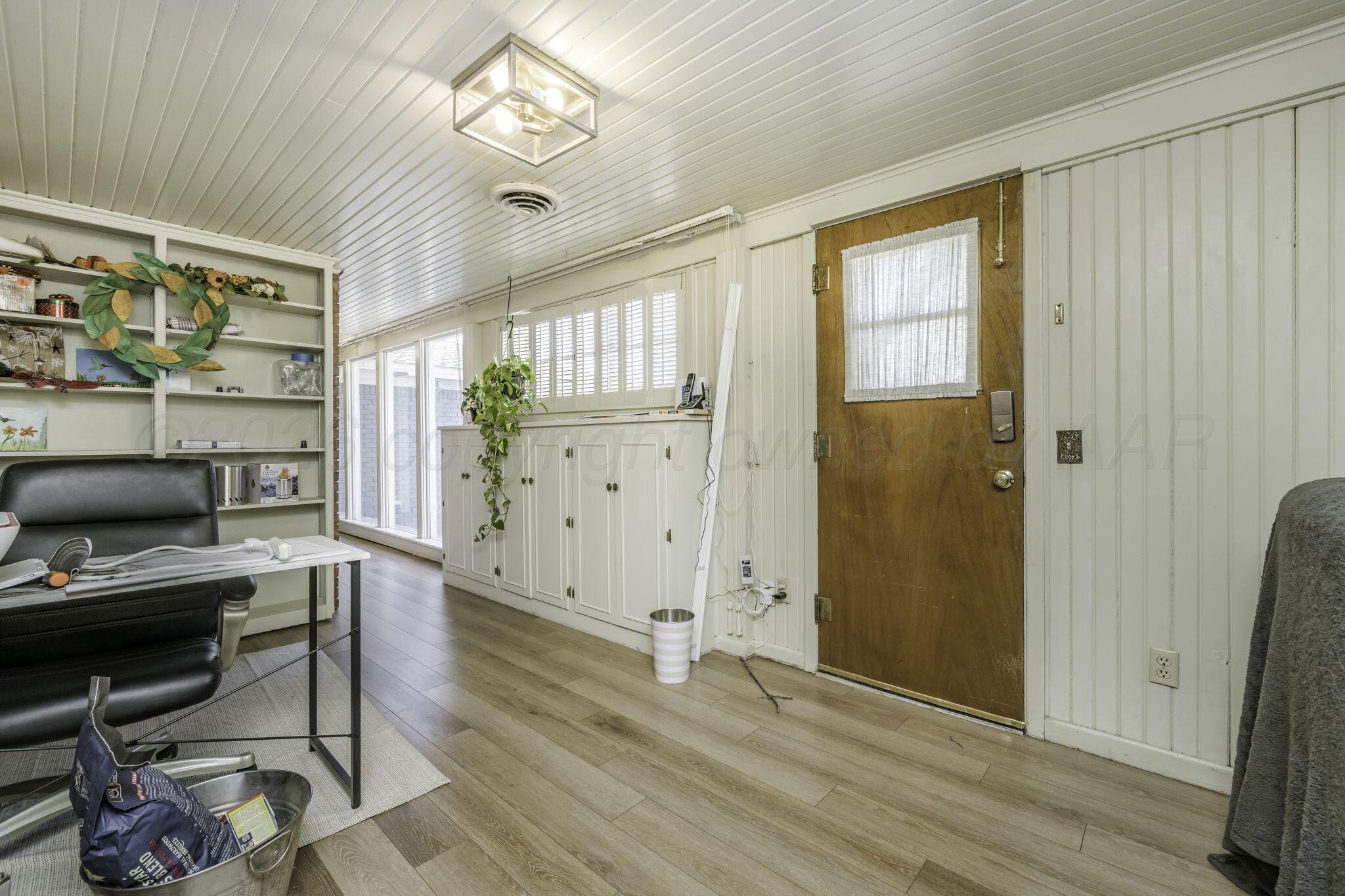 3228 South Travis Street Amarillo, TX 79109 - Photo 15 of 22 a view of livingroom with furniture and windows