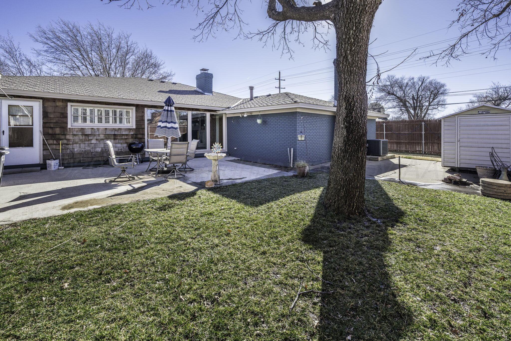 3228 South Travis Street Amarillo, TX 79109 - Photo 20 of 22 a front view of a house with garden and sitting area
