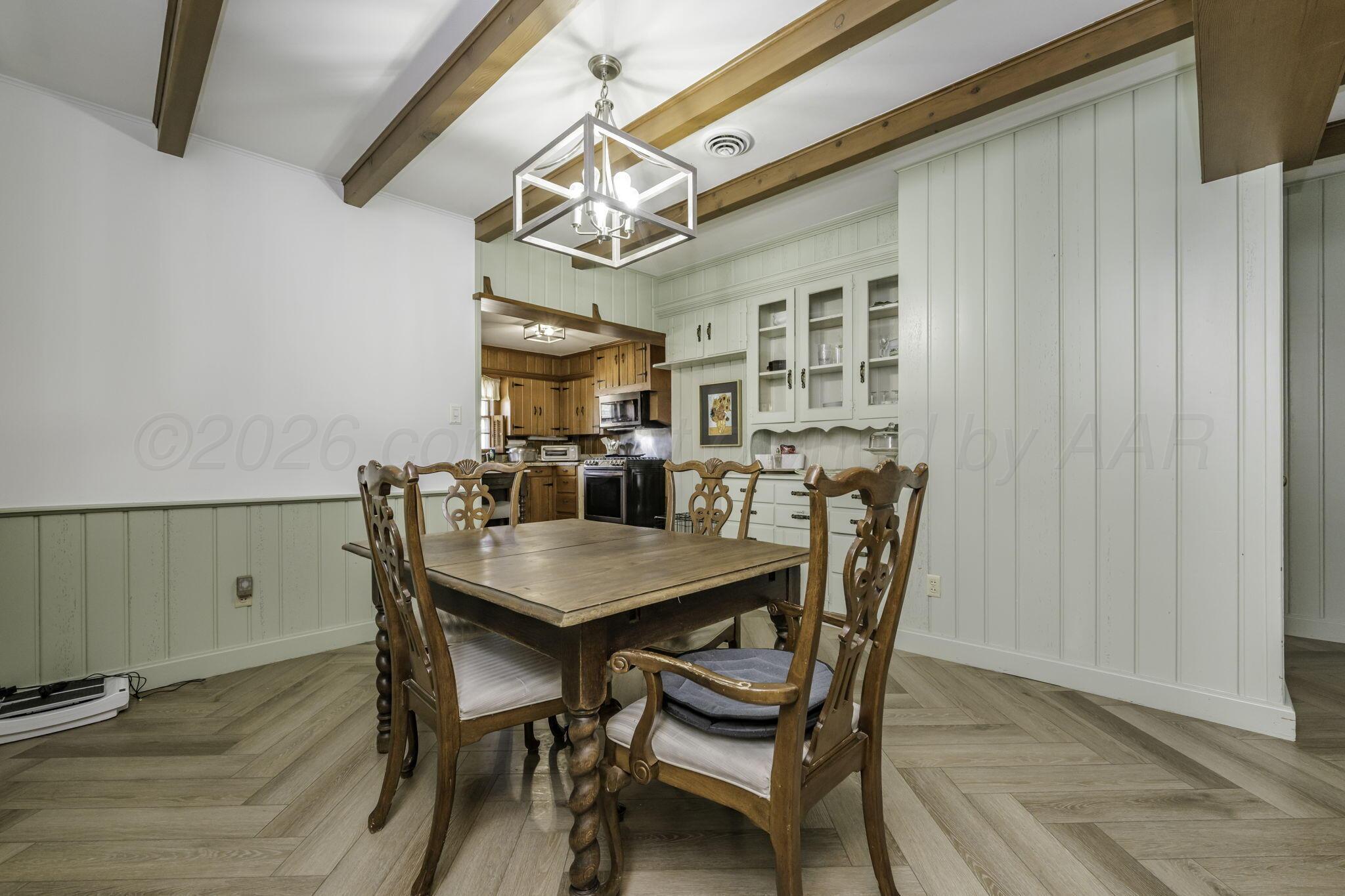3228 South Travis Street Amarillo, TX 79109 - Photo 9 of 22 a view of a dining room with furniture and chandelier