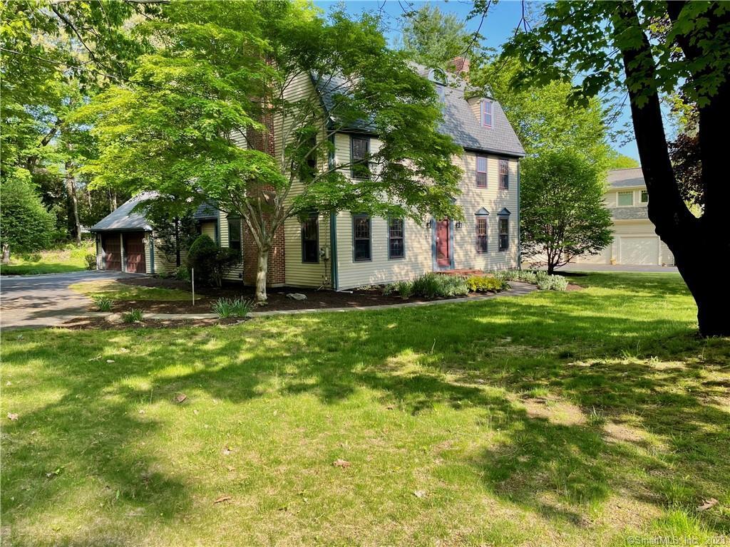 12 Stroll Rock Common Fairfield, CT 06824 - Photo 1 of 1 a front view of a house with garden