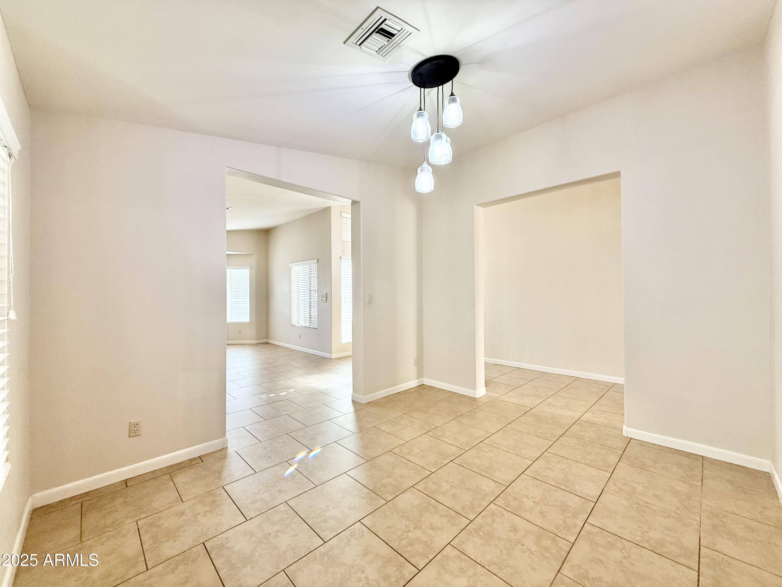 2718 East Bighorn Avenue Phoenix, AZ 85048 - Photo 12 of 31 a view of an empty room with a window