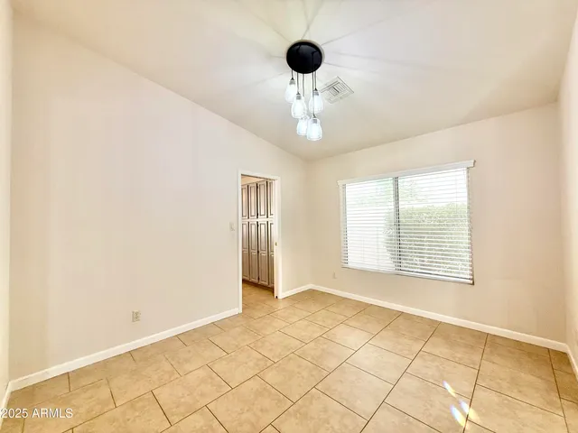 a view of an empty room with glass door