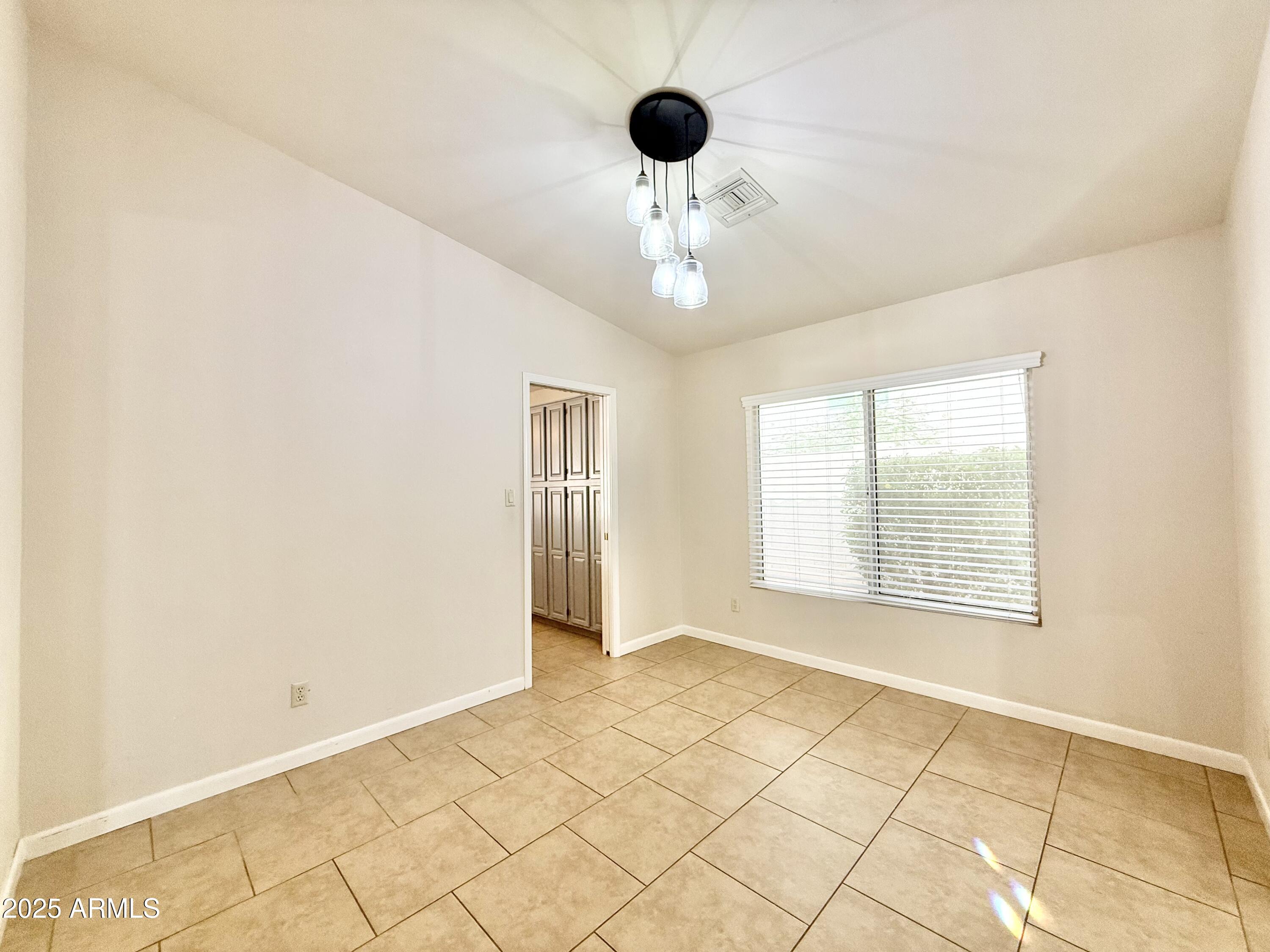 2718 East Bighorn Avenue Phoenix, AZ 85048 - Photo 13 of 31 a view of an empty room with a window