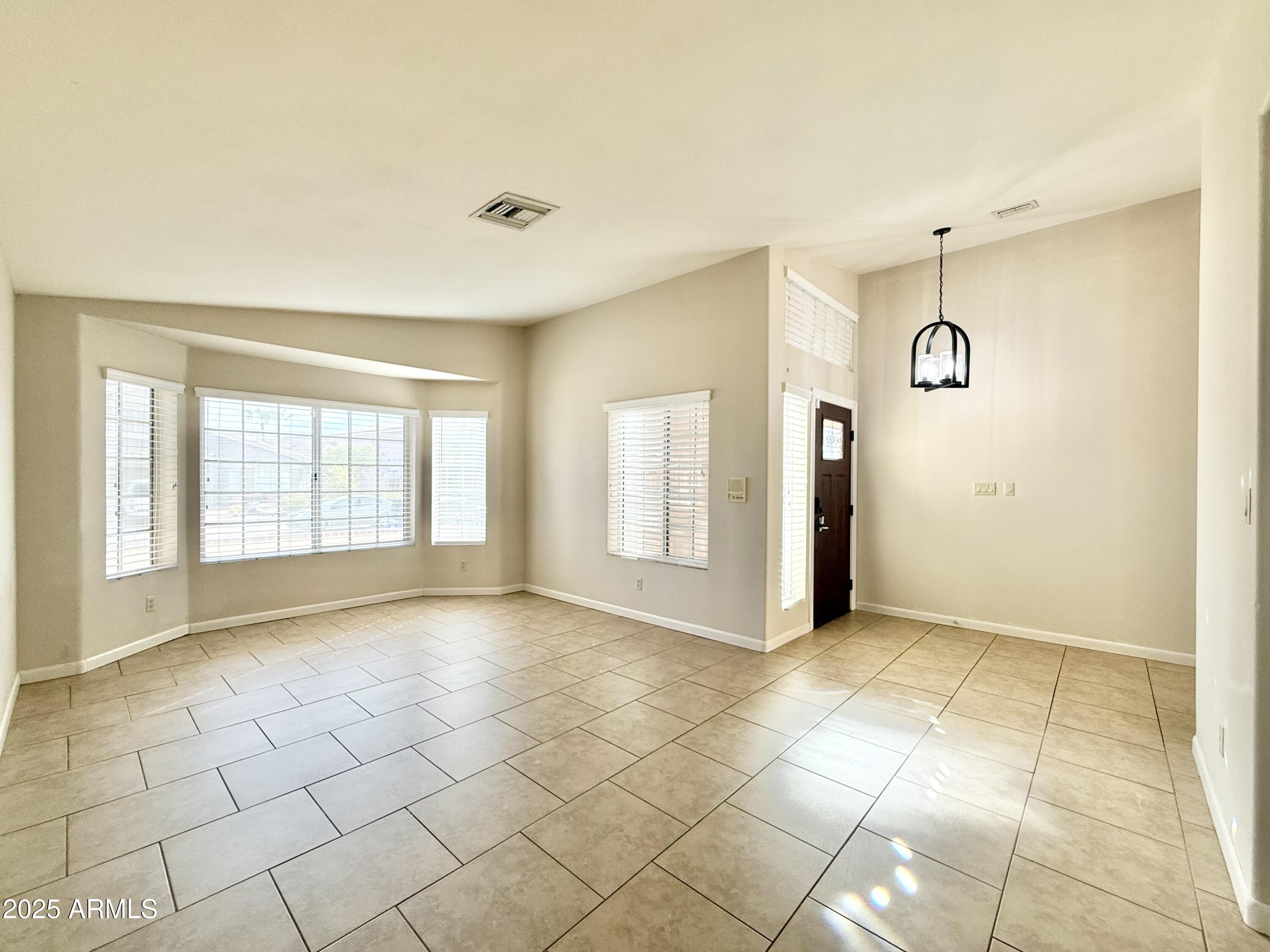 2718 East Bighorn Avenue Phoenix, AZ 85048 - Photo 14 of 31 a view of an empty room with glass door