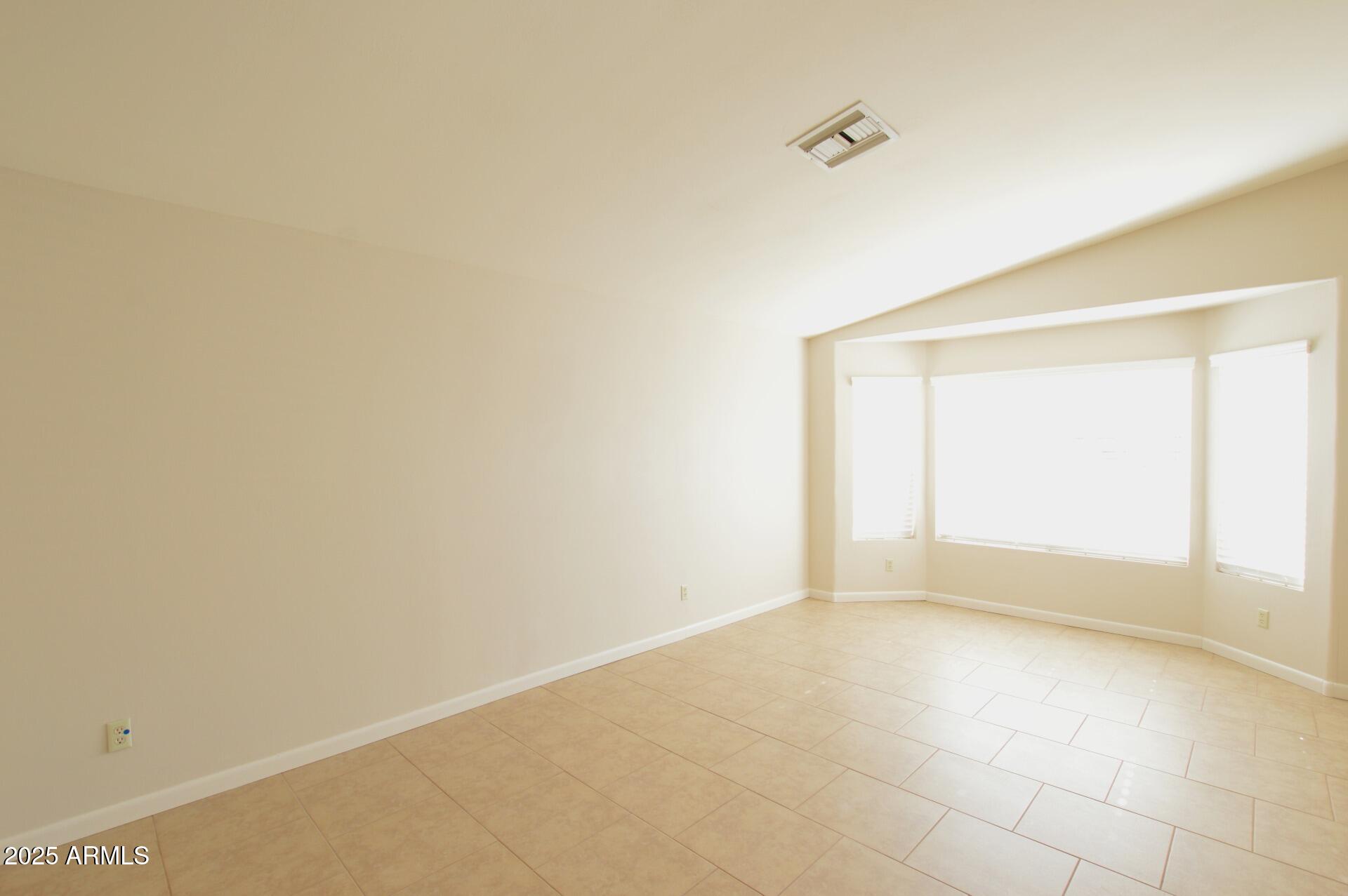 2718 East Bighorn Avenue Phoenix, AZ 85048 - Photo 15 of 31 a view of an empty room with a window