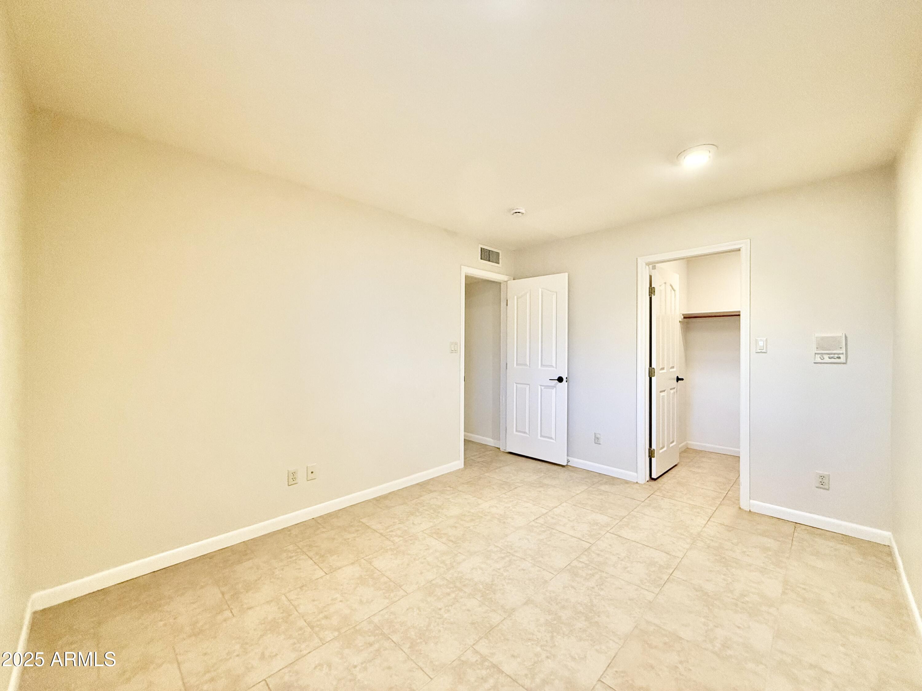 2718 East Bighorn Avenue Phoenix, AZ 85048 - Photo 22 of 31 an empty room with a natural light