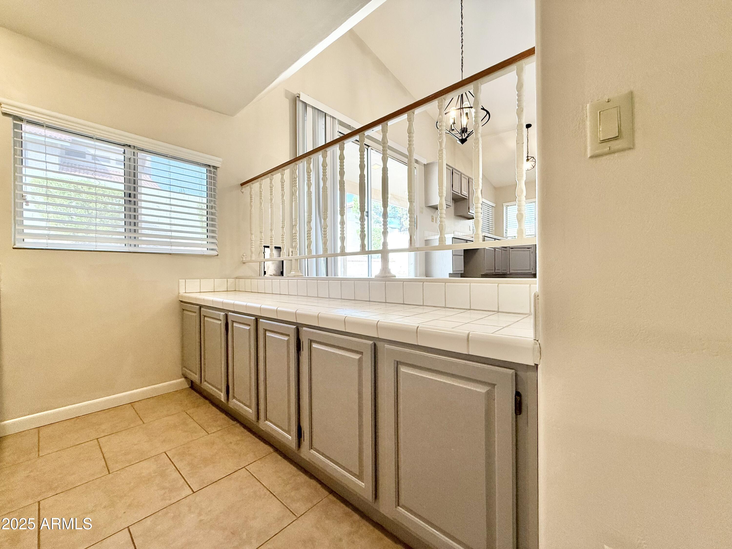 2718 East Bighorn Avenue Phoenix, AZ 85048 - Photo 25 of 31 a bathroom with a granite countertop sink and a large mirror