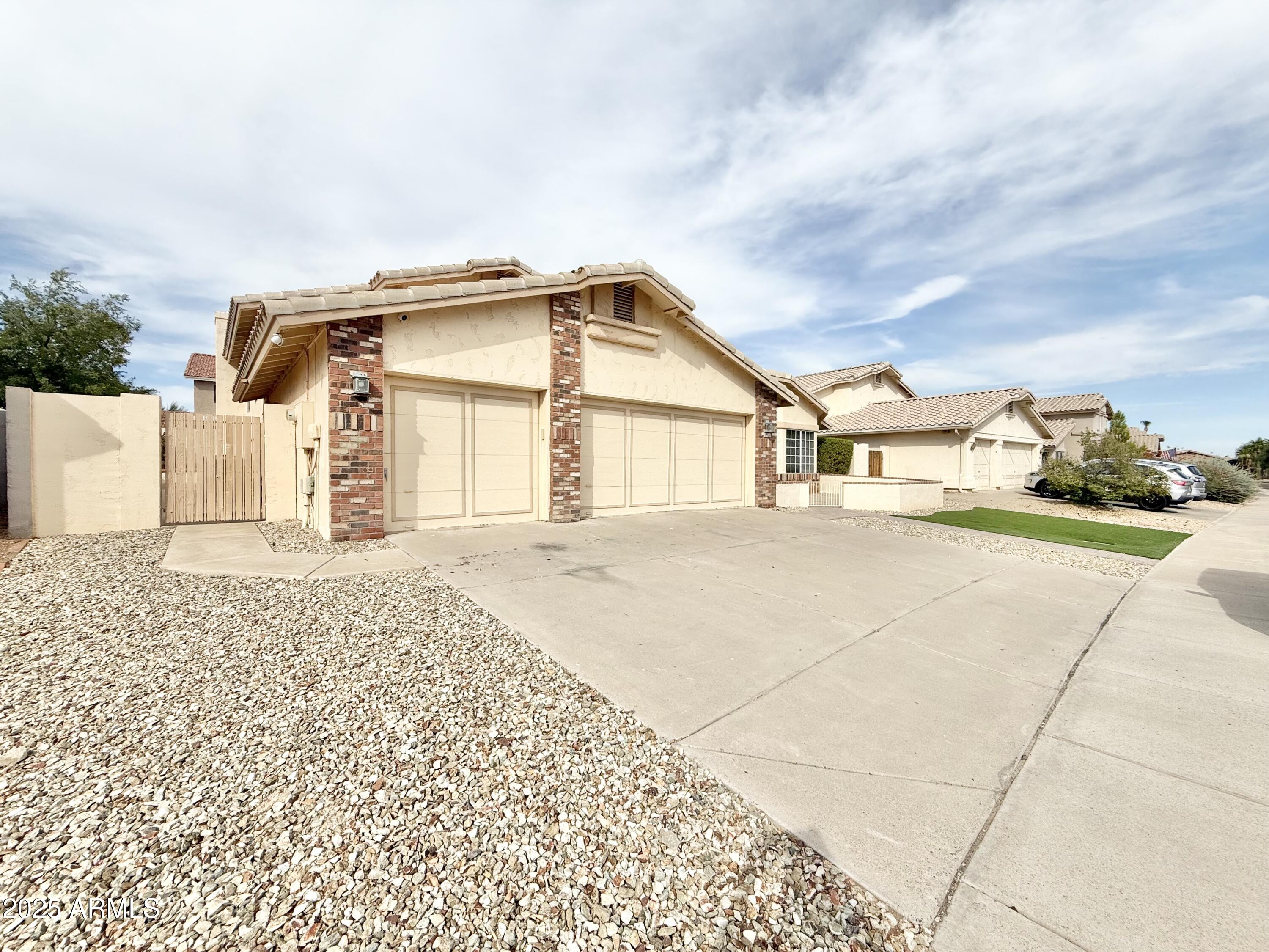 2718 East Bighorn Avenue Phoenix, AZ 85048 - Photo 3 of 31 a house with trees in the background