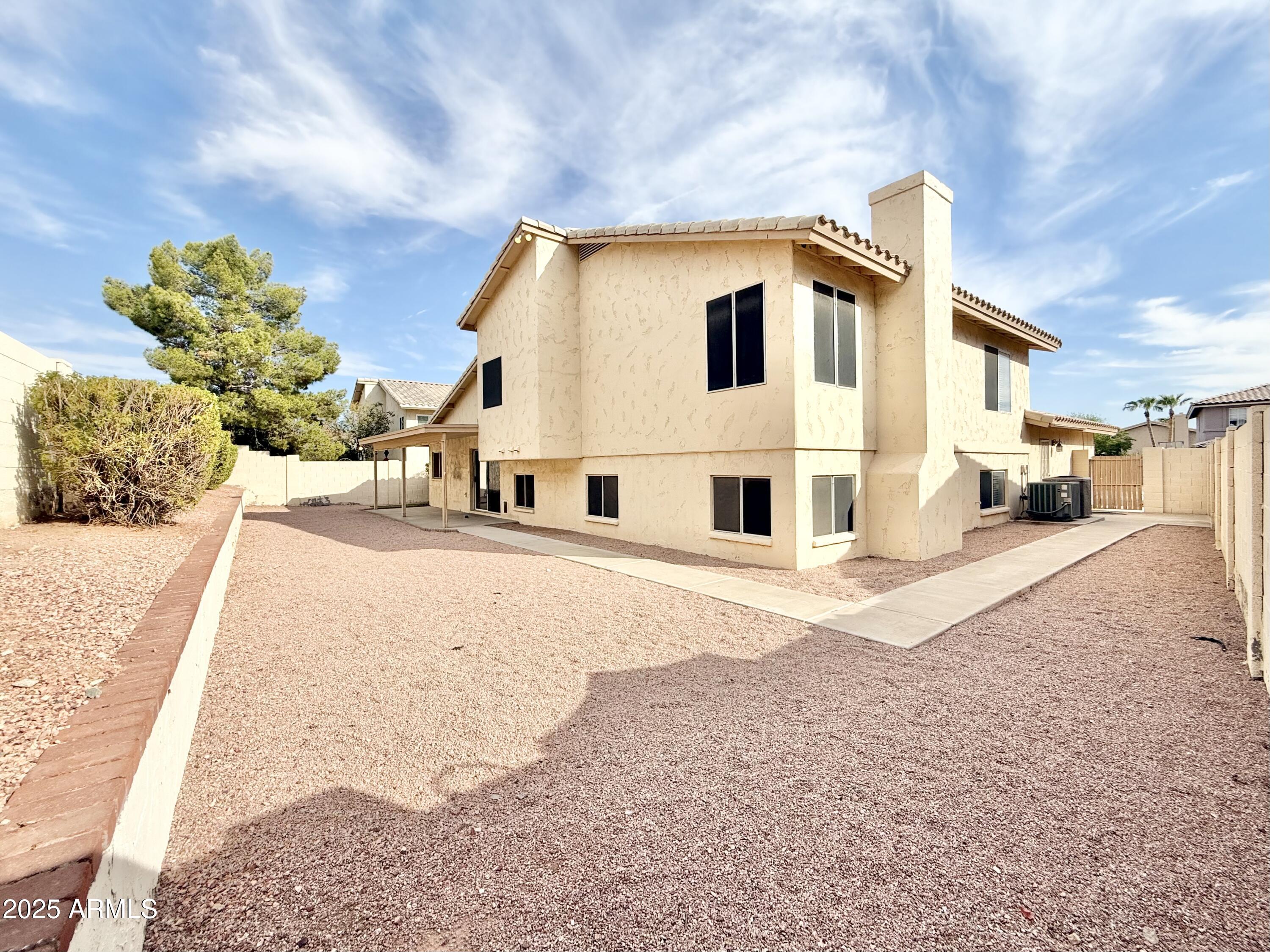 2718 East Bighorn Avenue Phoenix, AZ 85048 - Photo 31 of 31 a view of a back yard of the house