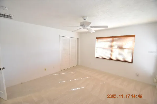 a view of a small space with a fan