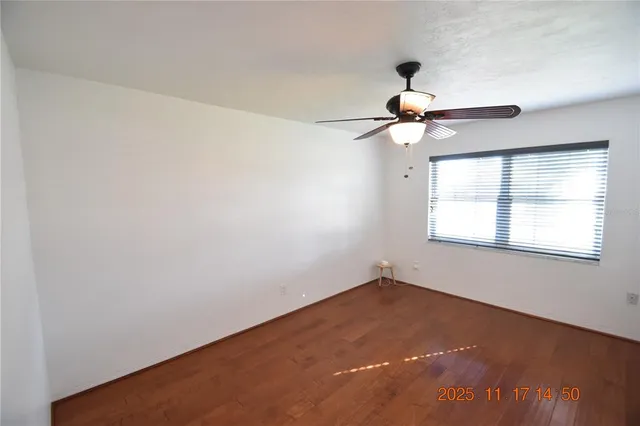 a en suite bathroom with a granite countertop sink and a mirror