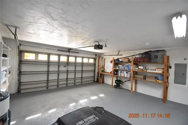 a backyard of a house with lots of green space table and chairs