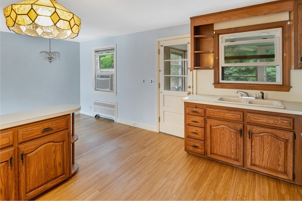 10 Wadsworth Road Arlington, MA 02476 - Photo 3 of 12 a room with wooden floors and a sink