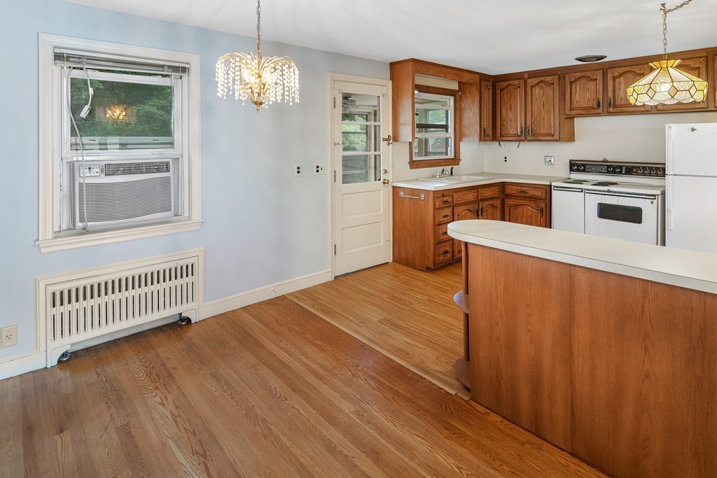 10 Wadsworth Road Arlington, MA 02476 - Photo 4 of 12 a view of a kitchen with wooden floor and electronic appliances