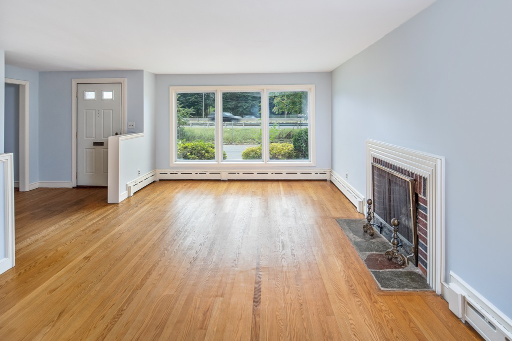 10 Wadsworth Road Arlington, MA 02476 - Photo 5 of 12 wooden floor in an empty room with a window