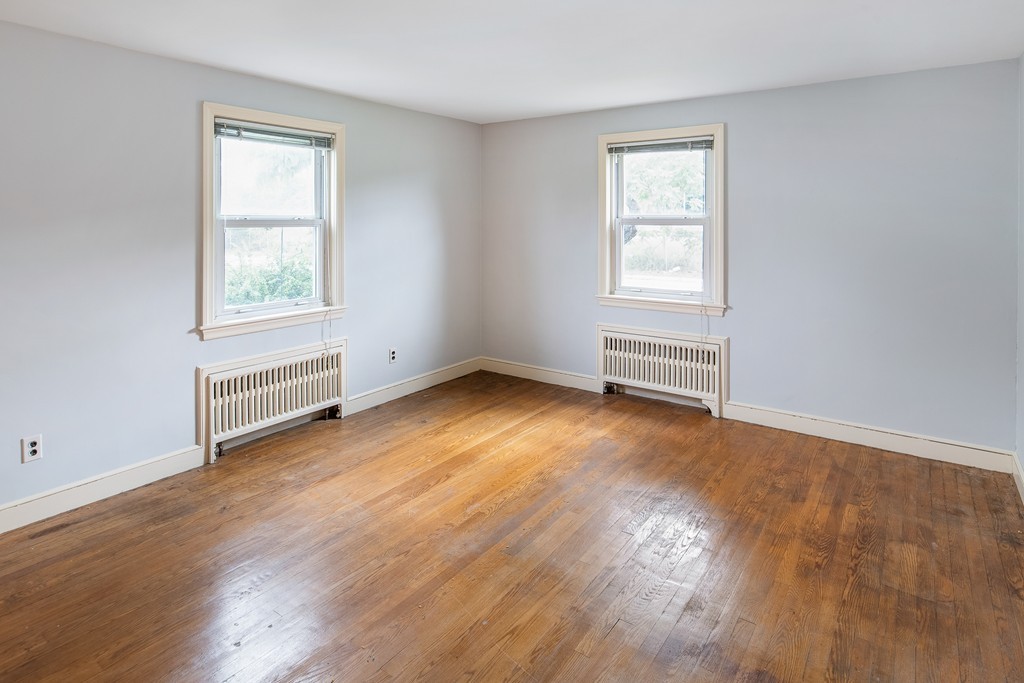 10 Wadsworth Road Arlington, MA 02476 - Photo 8 of 12 a view of empty room with wooden floor and fan