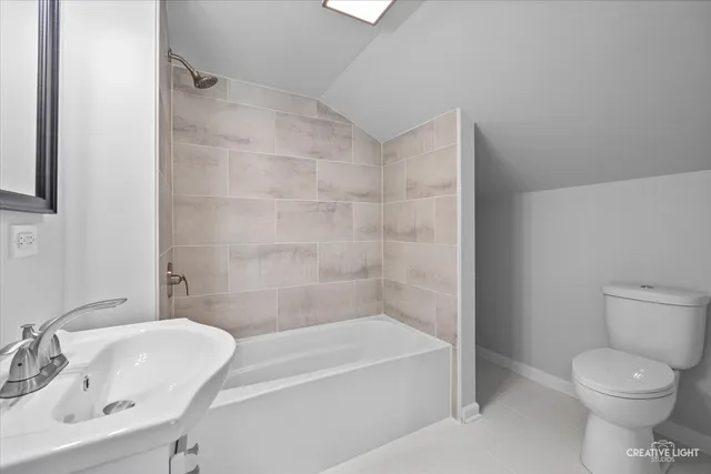 a bathroom with a toilet sink and bathtub