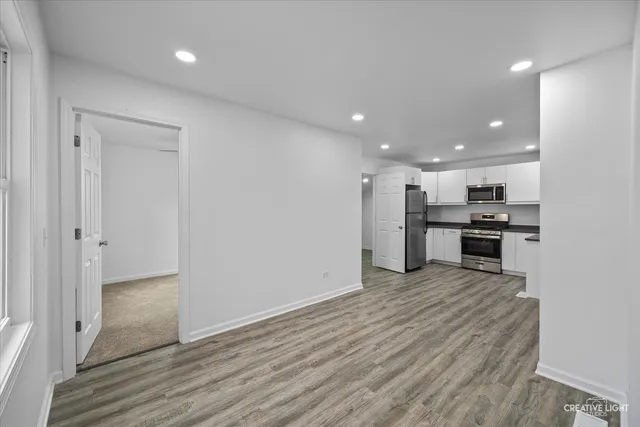 a view of kitchen with wooden floor