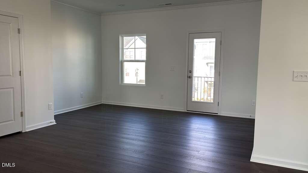 1443 Jay Road Knightdale, NC 27545 - Photo 15 of 46 an empty room with wooden floor and window