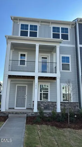 a front view of a house with garage